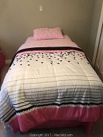 Assembled twin bed with comforter, bed skirt and pillowcase