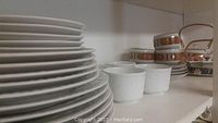 White plates and coffee cups with textured design, Mikasa patterned bowls and plates on kitchen cabinet shelf