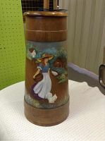 Full view of wooden butter churn with painted decoration, showing overall design and condition.