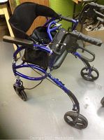 Front angle view of the walker highlighting padded seat, seatback, and frame