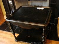 Black antiqued distressed side table full view showing top, legs and bottom shelf