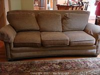 Full view of the Massoud light brown tweed sofa with three seat and back cushions.