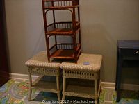 Two matching rectangular tan rattan tables with woven tops and lower shelves with decorative rattan weaving, shown side by side with natural color three-tier rattan table placed on top of one tan table.