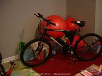 Full side view of the black Murray Eagle River 26" mountain bike, showing frame, wheels, and handlebar.