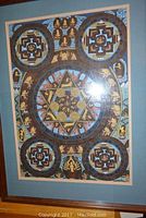 Full view of framed painting featuring circular mandala and symbolic imagery.