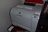 Photo of HP Color LaserJet CP2025 printer showing front and control panel