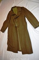 Full view of the brown wool great coat laid flat showing front and length.