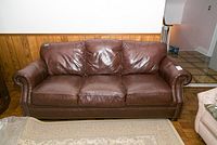 Full front view of the brown leather couch