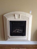 Front view of wall-mounted electric fireplace with surround