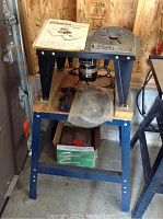 Black & Decker Workmate with router table mounted, showing structure and some accessories underneath