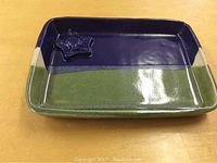 Rectangular ceramic dish with blue and green glaze, raised star-shaped medallion of Ronald McDonald's face in one corner.