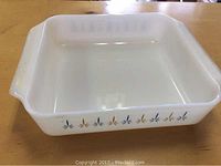 White square Fireking baking dish showing overall shape and size with handles