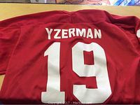 Back view of the jersey showing YZERMAN name and number 19 in large white print on red fabric.