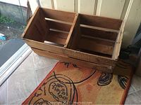 Top view showing the divided interior compartments of the wooden farm box and the general shape and construction.