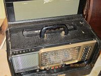 Top view of Zenith Trans Oceanic Wave Magnet shortwave radio, showing black leatherette with handle, tuning dials, buttons and speaker grille