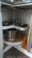 Corner cabinet Lazy Susan with stainless cookware, Big Berkey chamber, glass lid and pepper mill