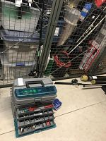 Overall view showing two fishing rods with reels and the tackle box