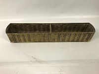 Full view of the long brass planter showing its shape, size and two compartments.