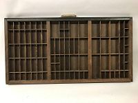 Full top view of the wooden typesetter's tray showing the compartments and handle