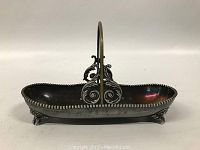 Front angle showing the decorative beaded edge and scroll handle of the tray