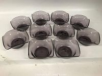 Ten amethyst-colored glass bowls arranged in two rows, showing the shape, color and size.
