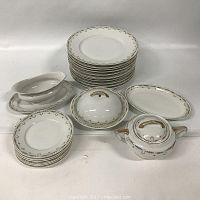 Overview of the Victoria dinnerware items displaying plates, serving dishes, gravy boat, covered bowl, and sugar bowl.