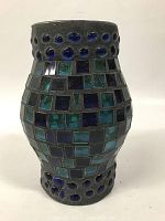 Lamp shade with a black metal frame decorated by blue and green glass tiles and glass beads, shown on a plain white background.