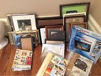 Wide view of all photo frames, digital photo frame in box, and photo books on floor