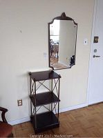 Three-tier wood and metal shelf unit with dark stained wood shelves and metal frame.