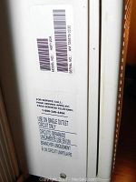 Close-up of model and serial number label on side panel