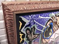 Close-up photo showing the ornate gold tone frame and colorful abstract acrylic painting with animal motifs including a butterfly shape.