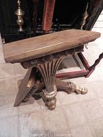 Side table showing the split two-piece wooden top and twisted wooden legs, rustic finish visible