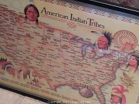 Close-up photo of framed American Indian Tribes print featuring illustrated portraits and detailed map of tribes in the United States.