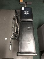 Full view of bench backrest and bars on floor