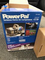 Box of PowerPal tankless home air compressor with product images and specifications on the outside.