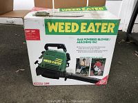 The boxed Weed Eater gas powered blower showing front of packaging with product image and details.