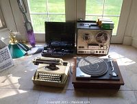 Lot of assorted electronics including Royals Royalite manual typewriter, Pioneer PL-514 turntable, TEAC reel to reel recorder, and Sony Handycam in case.