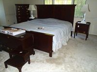 Overall view of assembled king bed frame with mattress (for display only); shows headboard, footboard and finish.