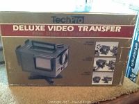 Original packaging box of TechPro Deluxe Video Transfer System showing front and side views.