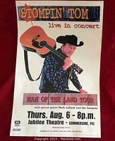 Full view of 11x17 inch poster showing Stompin' Tom holding guitar, event details and tour title.
