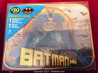Front of sealed packaging showing Batman lunch box and DVD set with $30 value sticker.