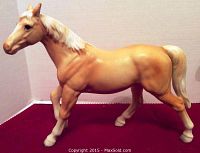 Tan china horse figurine side view showing body and head details