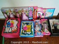 Full shot showing all Barbie dolls in original packaging along with Doll Trunk and Doll Case with contents visible