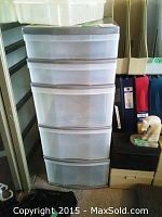 Two white plastic drawer storage stands with multiple drawers stacked or adjacent, approximately 13x11x32 inches each.