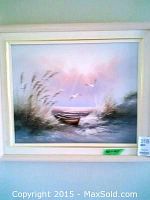 Framed oil painting of beach scene with boat and birds in pastel colors