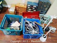 Photo showing two plastic baskets containing electrical wires, tape, and miscellaneous small items with plastic hardware storage drawers in the background.