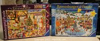 Two Ravensburger Christmas puzzles in original boxes: 'The Christmas Shop' and a snowy village market scene, both 1000 pieces, Limited Edition.