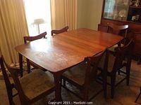 Overall view of assembled table with all six chairs in room