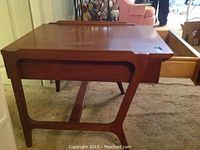 Mid-century Lane end table side view showing drawer pulled open and leg design.