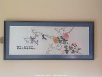 Full view of the framed wall art showing the artwork with birds, flowers, and Chinese calligraphy.